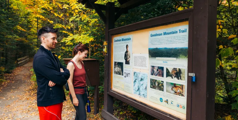 A couple learning about Goodman Mountain's namesake