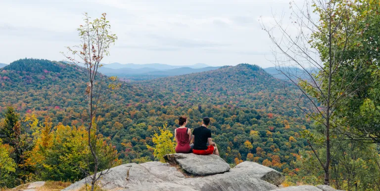 Two hikers at a scenic overlook