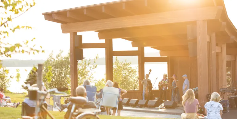 A wooden bandshell with live music happening