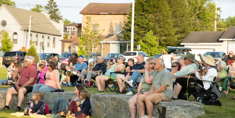 People listening to live music at a park