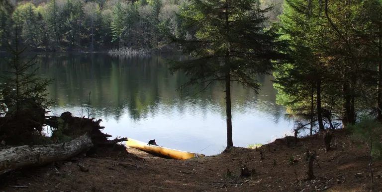 The tranquil waters of Little Tupper Lake beckon the paddler
