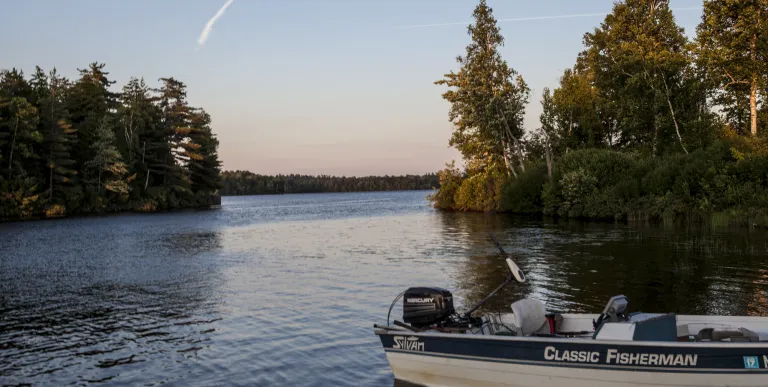 A boat on the shore of an inlet