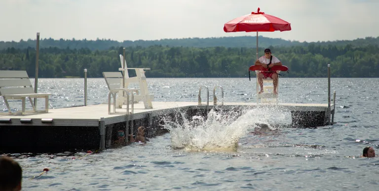 Young kids race into the water