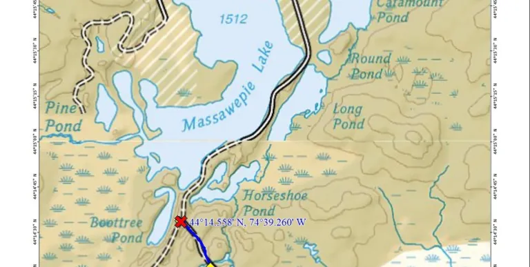 A map with bodies of water and a road cutting through.