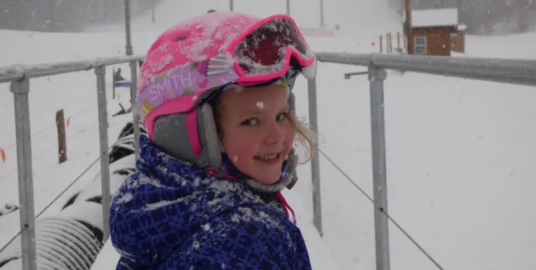 A kid at Titus Mountain on a snowy day.