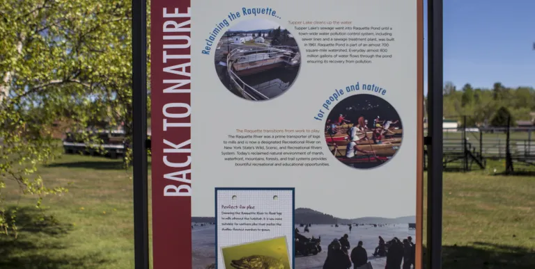 Flander's Waterfront Walkway has interpretive stations about Tupper Lake.
