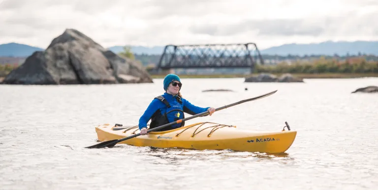 A paddler on a pond