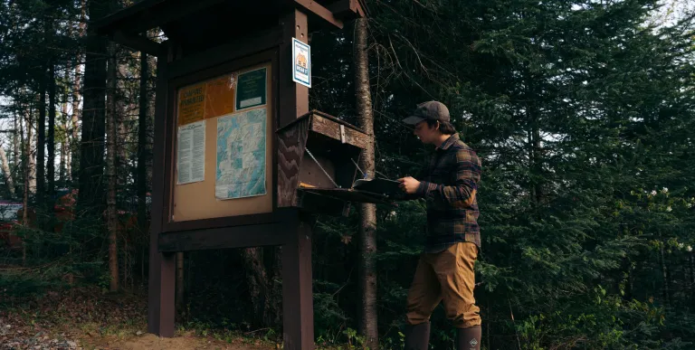 A paddler signing into a register