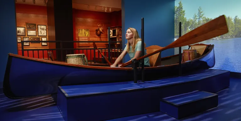  A woman rows a display boat