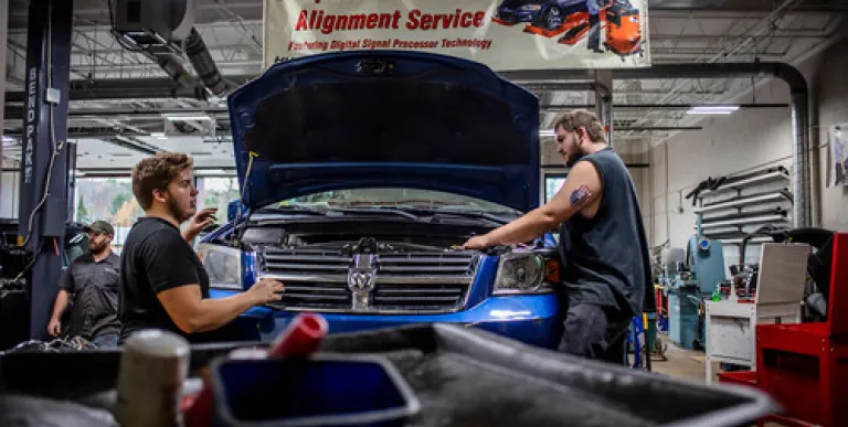 Students work on cars