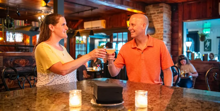 a couple cheering drinks