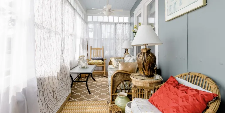 The front walkway up to a landing and the three season room.