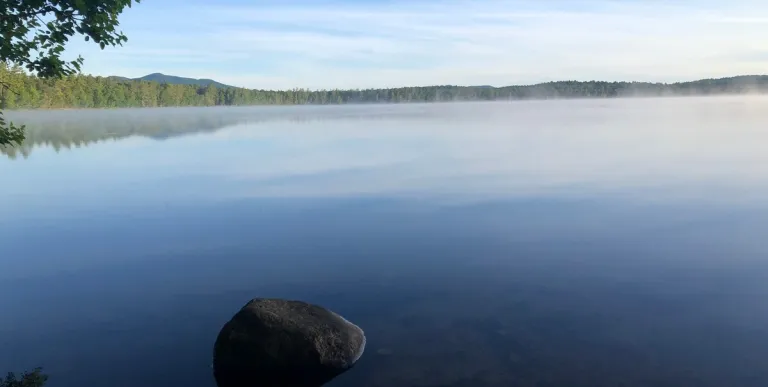 The smooth as glass waters of Lake Clear