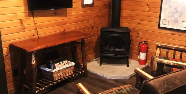 The living space with two rustic arm chairs