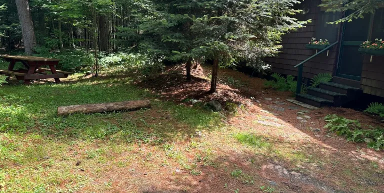 Rustic bedding in the cozy sleeping space at Rockledge Cabins & Retreats 