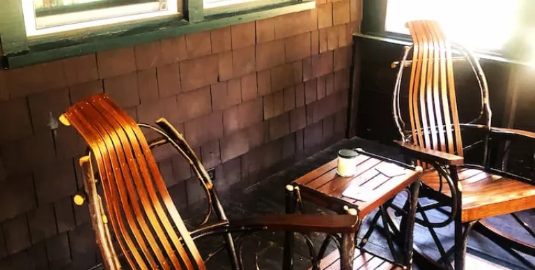 A bedroom with knotty pine paneling