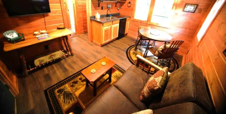  wood stove and tv at Rockledge Cabins & Retreats 