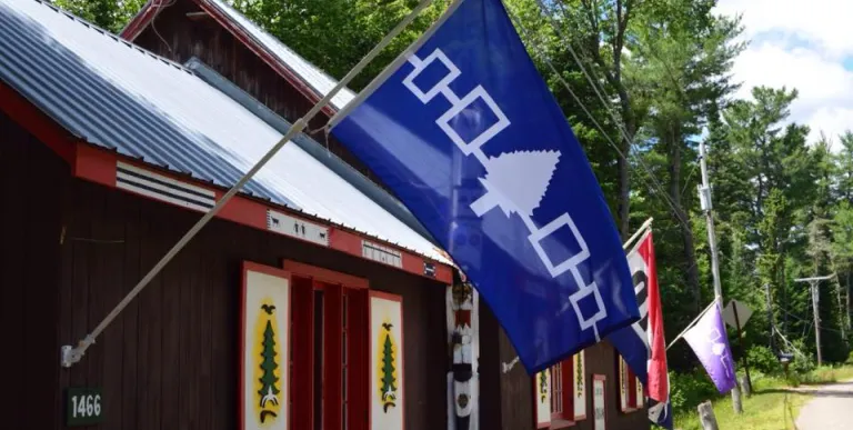 A blue flag hangs outside.