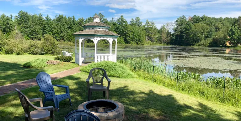 The white gazebo by the water at Sara Placid Inn & Suites.