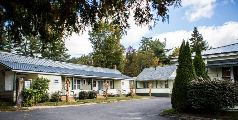 The exterior of two building and the parking lot of The Ashley.